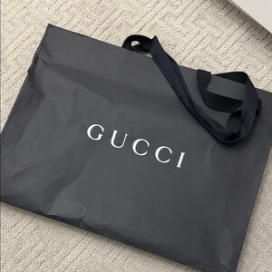 Gucci Black Logo paper Bag (small ripped on the side)